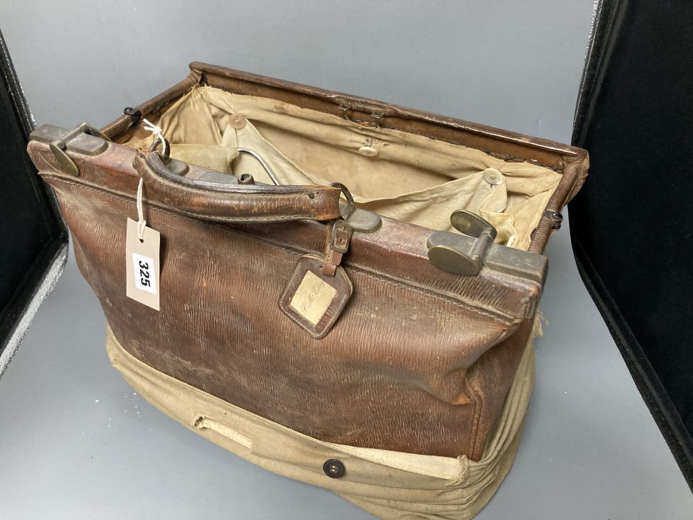 A Victorian leather doctors Gladstone bag including doctors equipment, height 29cm excluding handle